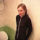 An attractive blonde girl pees while sitting on a toilet and lets out a fart near the end.